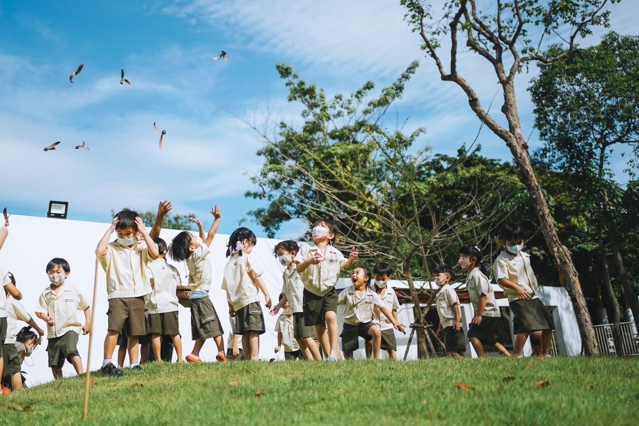 Children running in green lawn
